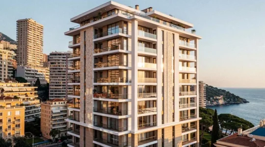Modern luxury residential building with glass balconies in Monaco's dense urban landscape